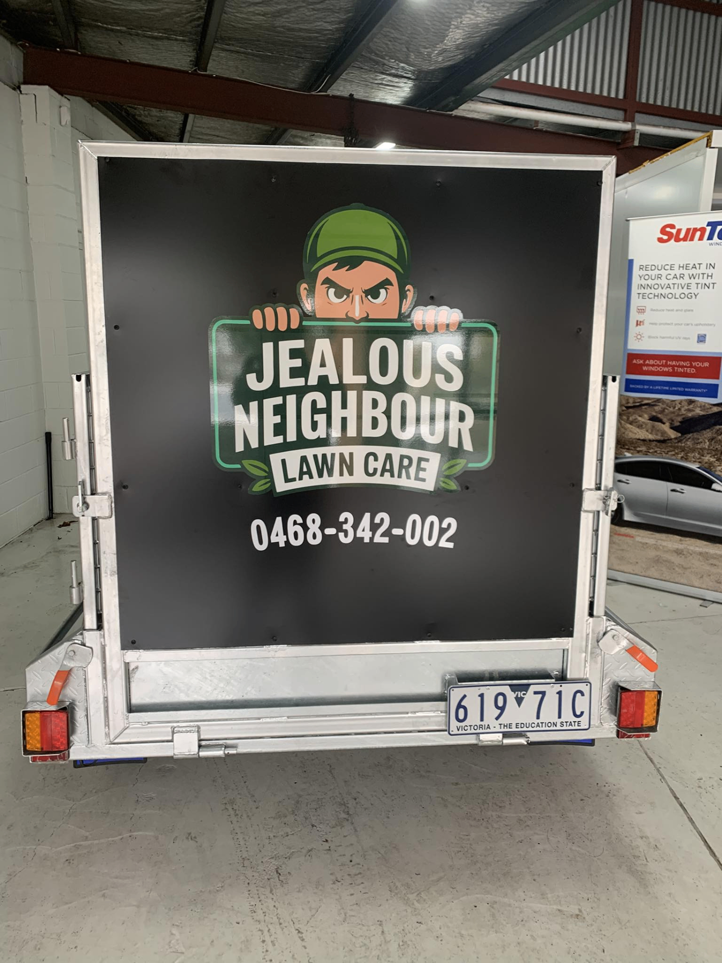 Jealous Neighbour Lawn Care branded trailer
